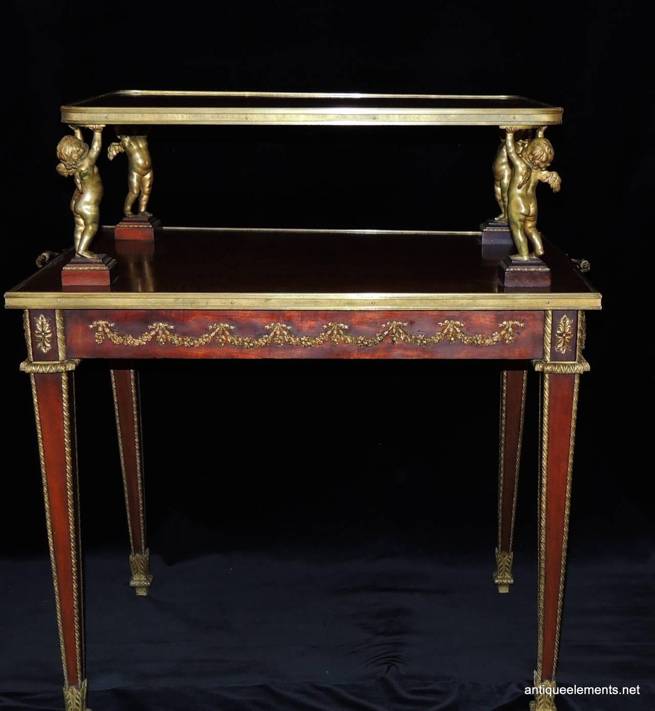 Belle Époque Exceptional Two Tier French Dore Bronze Ormolu Mounted Table Adorned W/ Cherub