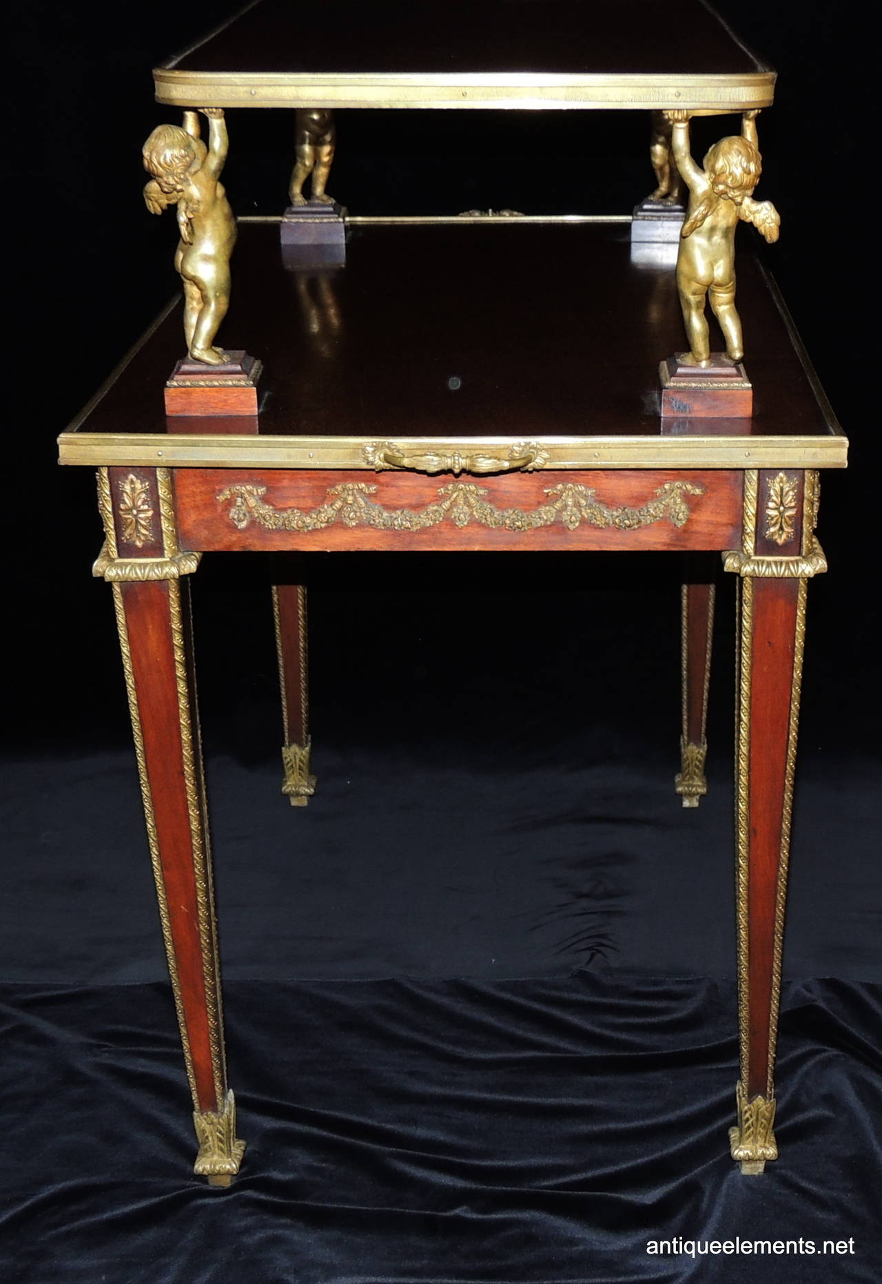 Exceptional Two Tier French Dore Bronze Ormolu Mounted Table Adorned W/ Cherub In Good Condition In Roslyn, NY