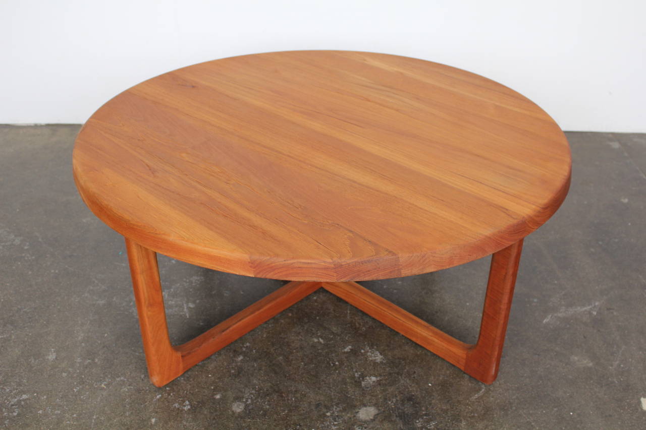 Gorgeous round coffee table in a stunning solid teak, circa 1960s, made in Denmark, newly refinished.