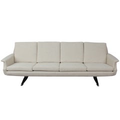 Mid Century Modern 4 seat sofa on metal legs.