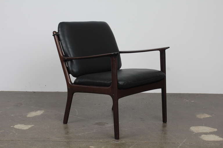 Beautiful mahogany Danish lounge chair by Ole Wanscher, with matching two seat sofa available separately. Newly upholstered in black leather and refinished in lacquer.