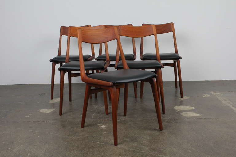 Beautiful Set of Six Teakwood Boomerang Dining Chairs by Erik Christensen for Slagelse, 1960, Denmark.  Upholstered in black leather.