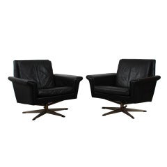 Pair of Danish Mid Century Modern Black Leather Swivel Chairs.