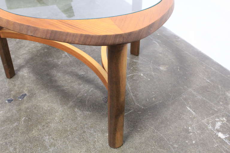 Mid-20th Century English mid century modern rounded glass top and teak coffee table.