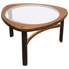 Vintage English mid century modern rounded glass top and teak coffee table.