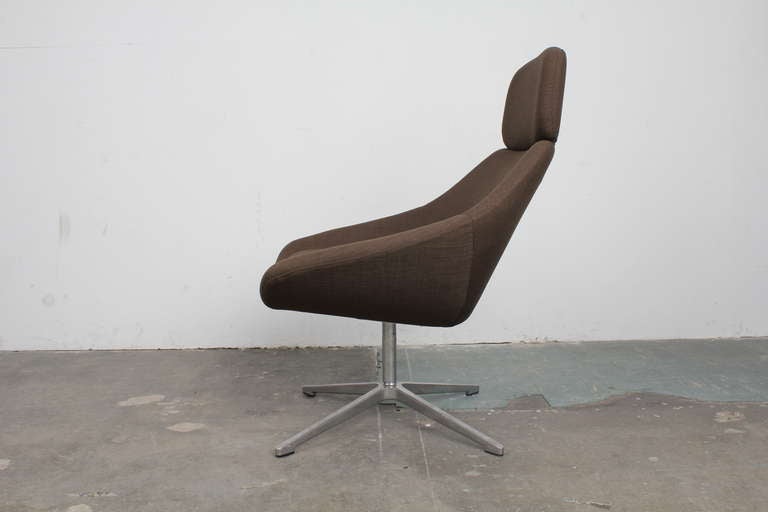 Uniquely shaped and very comfortable mid century modern lounge chair.  This item has been newly upholstered.  Additional chairs available.