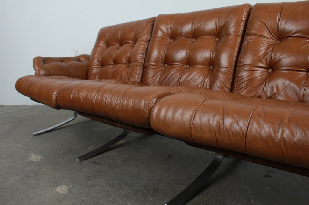 leather couch with metal frame