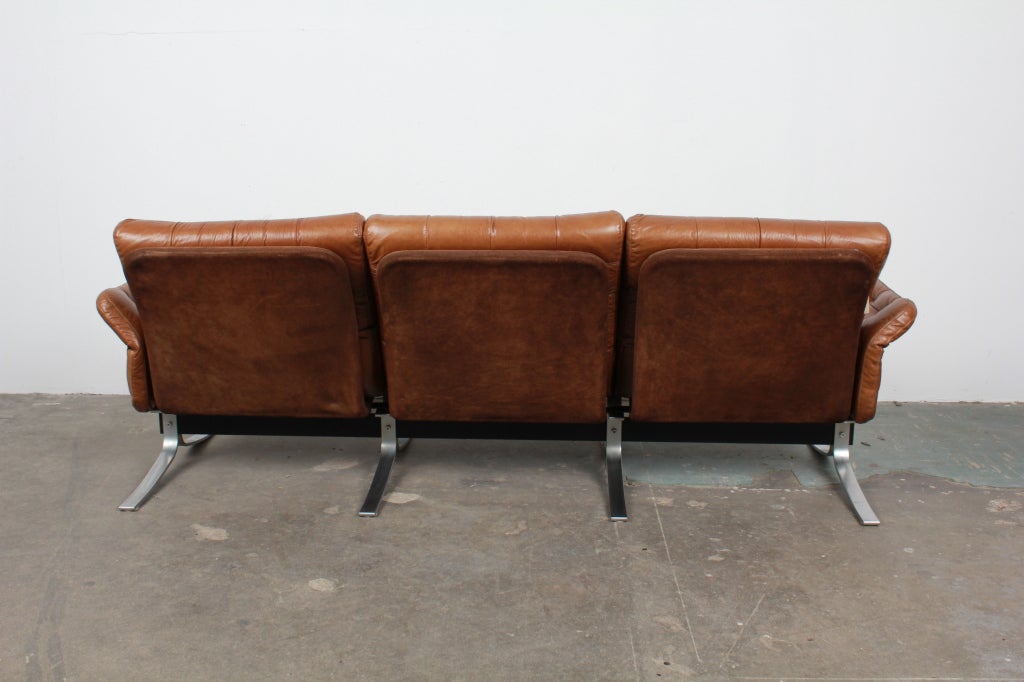 Mid-20th Century Danish Modern Tufted Leather and Metal Frame Sofa by Ebbe Gehl.