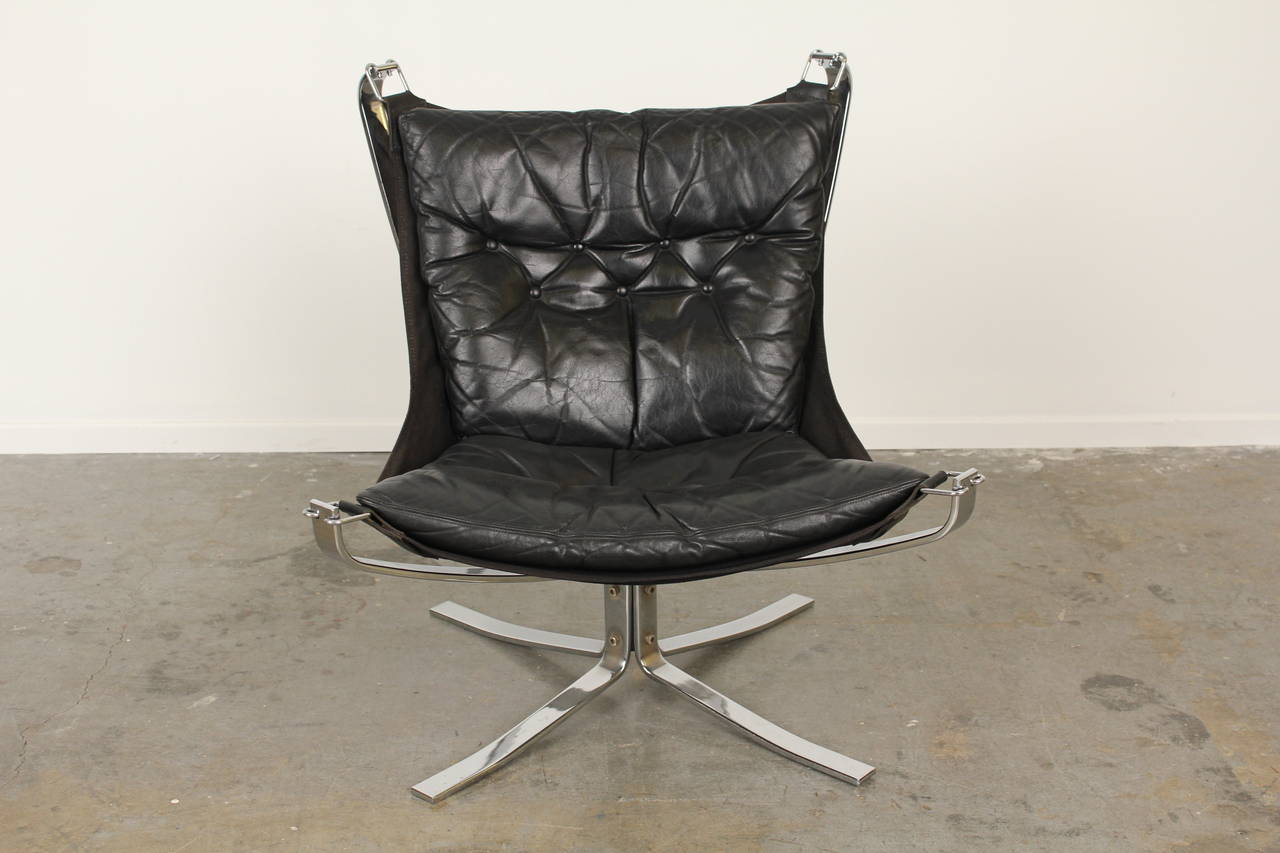 Superb falcon chair by Sigurd Ressell in the original black vintage leather. Sculptural chrome base. Fantastic statement piece and incredibly comfortable.