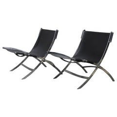 Pair of Mid-Century Chrome and Leather Lounge Chairs, attr. Paul Tuttle