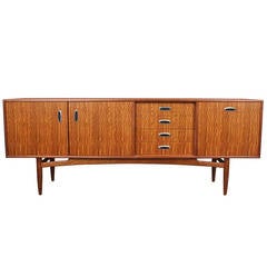 G-Plan mahogany long, low sideboard with metal pulls.