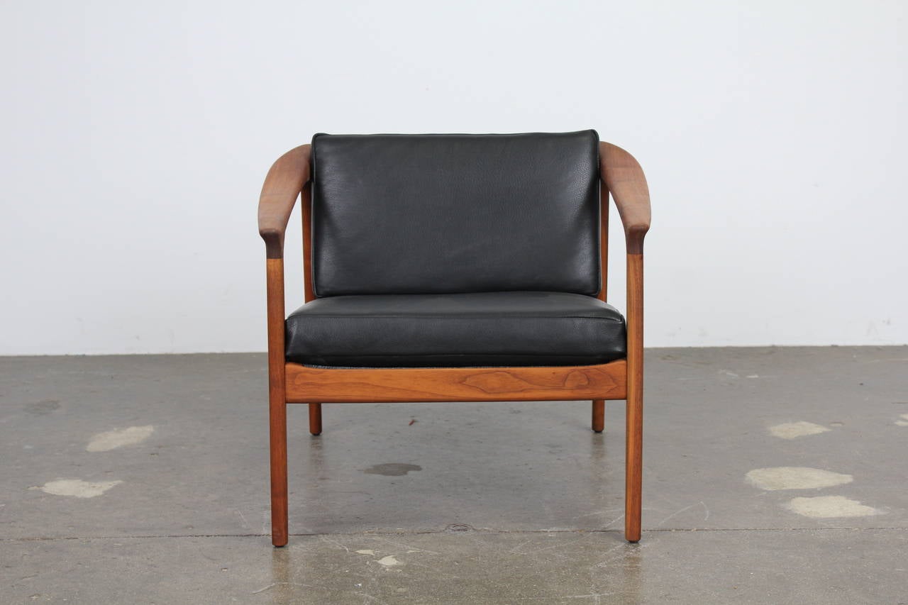 Swedish Solid teak and black leather lougne chair by Folke Ohlsson for Dux