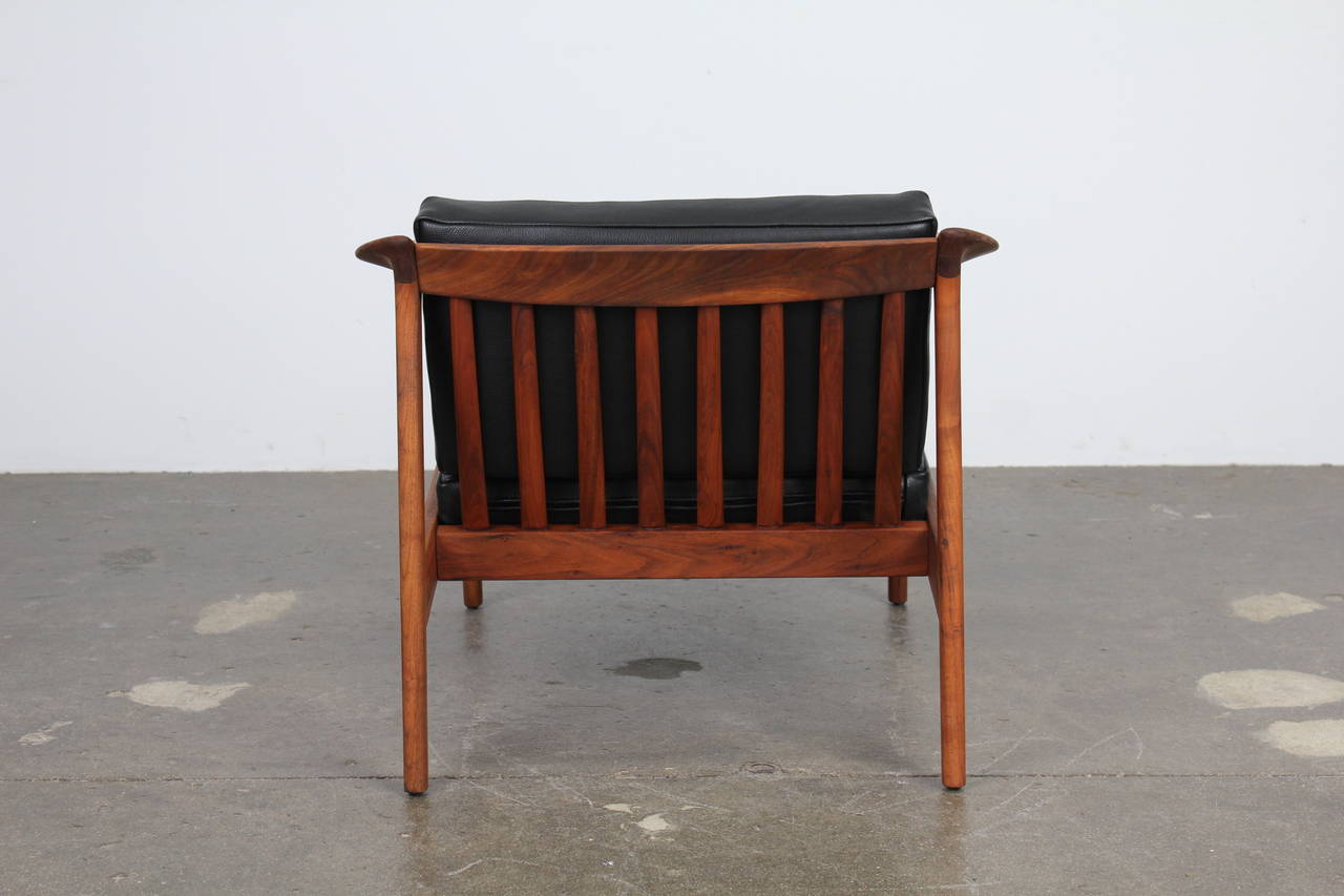 Mid-20th Century Solid teak and black leather lougne chair by Folke Ohlsson for Dux