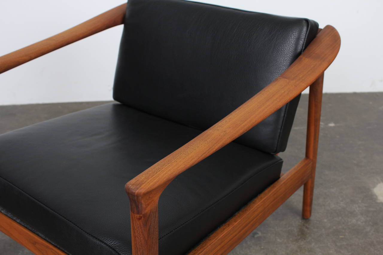 Solid teak and black leather lougne chair by Folke Ohlsson for Dux 3