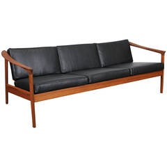 Solid teak and black leather 3 seat sofa  by Folke Ohlsson for Dux