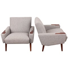 Pair of Danish mid century lounge chairs with teak accents.