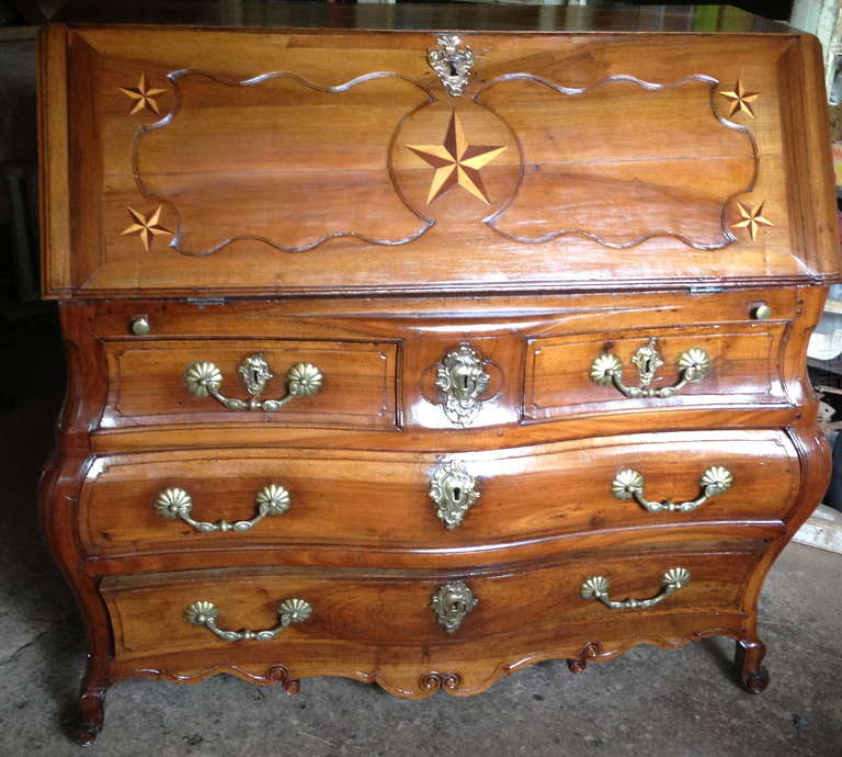 Rare dresser_ desk  called Scriban walnut opening with three drawers at the bottom and a lid on top .
The lower part of so-called 
