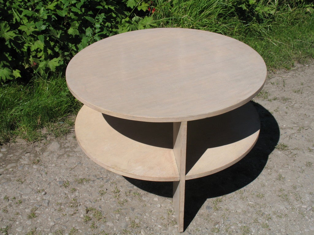 A Circular two tier coffess table in Birch ply with a semi transaparent Dove grey finish designed by Gerald Summer for Makers of Simple Furniture.