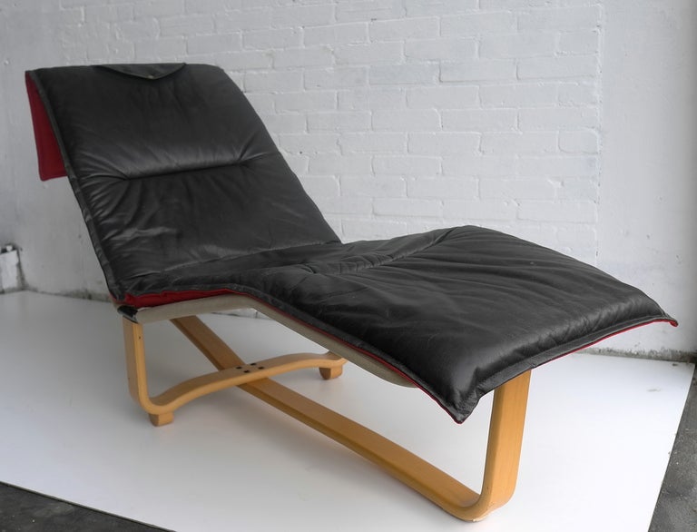 Westnofa lounge chair black leather and wood at 1stDibs