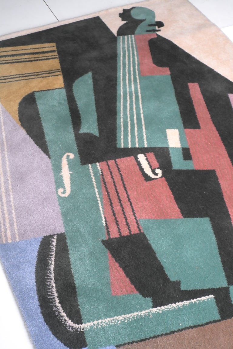 Juan Gris Violin-1916 art rug. Made by Ege Axminster A/S art line Denmark 1990. With Juan Gris signature in bottom left hand corner. This large colourful rug is made of 100% wool.