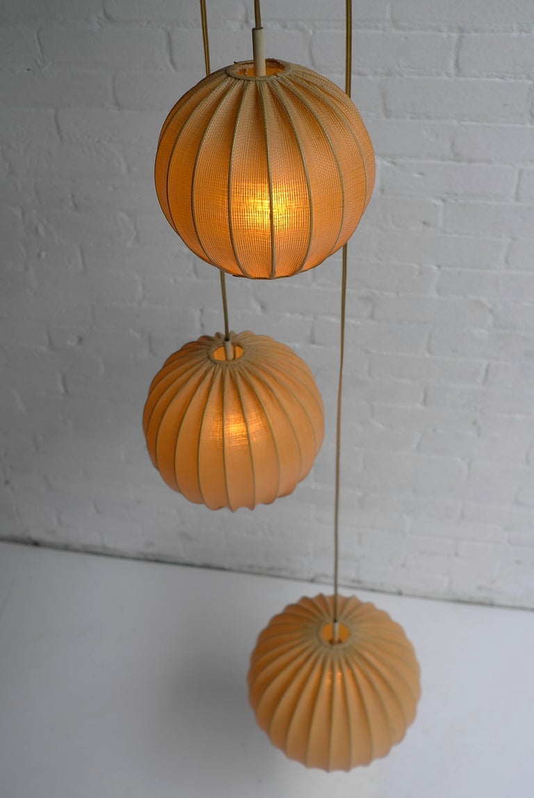 Cocoon pendant lamp 1950's. Gives a very nice warm light when lit.
The balls have three different sizes from small to large. Most probably a Danish or German made.