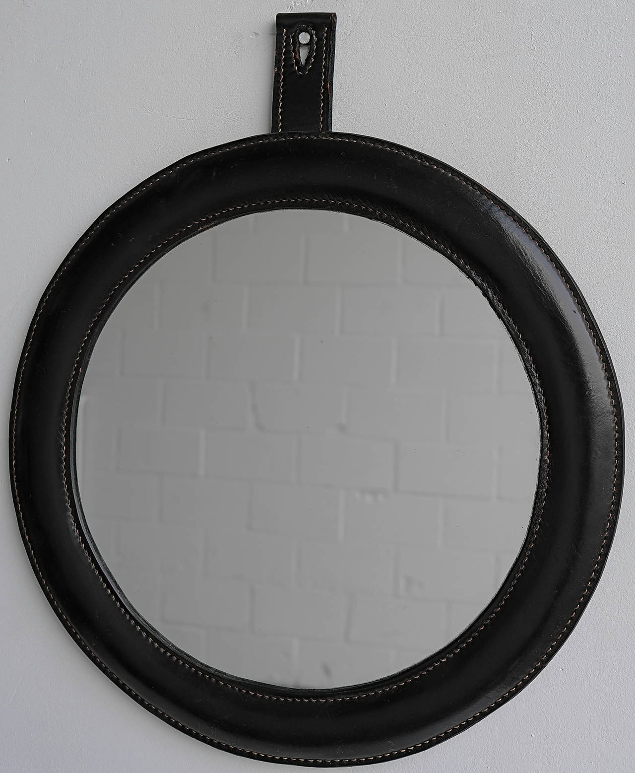 Hand stiched black leather wall mirror in style of Jacques Adnet