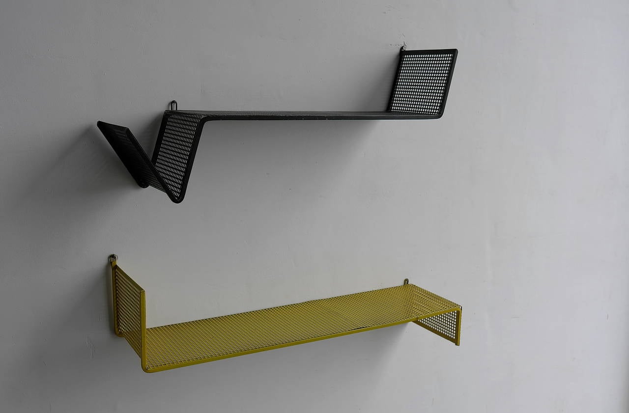 Designed by Mathieu Matégot. Pair of black and Yellow metal perforated shelves. Manufactured by Artimeta The Netherlands in the 1950's