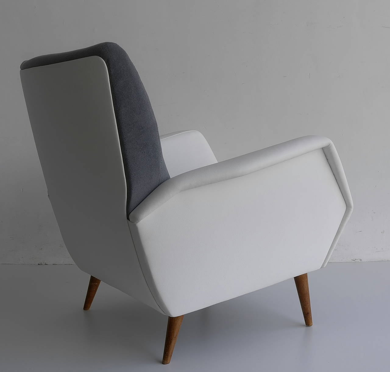 Gio Ponti armchair model 803, Italy, 1954.

Cassina,  Italy, 1954.
 Vinyl, upholstery, walnut .
Measurements: 29.5 W x 33 D x 31 H inches.

Gio Ponti: l'Arte Si Innamora dell'Industria, La Pietra, pg. 232 Gio Ponti: Interni, Oggetti, Disegni