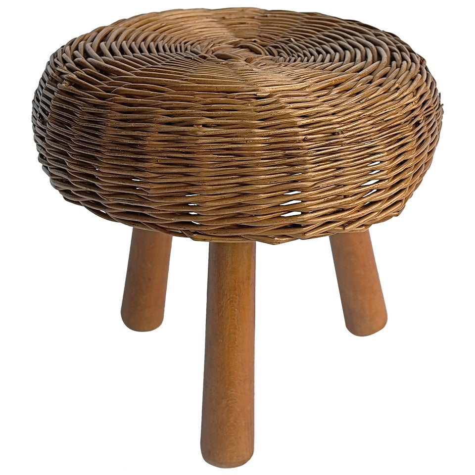 Wicker round stool in the style of Charlotte perriand