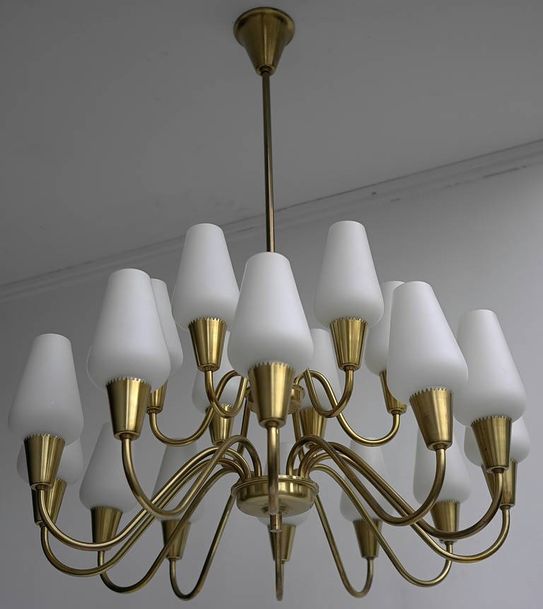 Brass and opaline glass chandelier, Finland, 1960s.

Well made quality piece that gives a very warm light.
