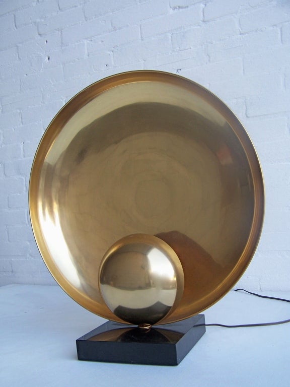 Imposing large sculptural copper table lamp on a black marble base.