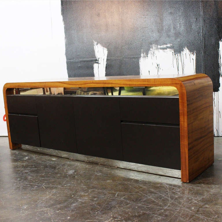 Credenza designed by Vladimir Kagan and hand crafted at VK Design New York. Veneered in beautifully figured Avodire over solid oak substrate.
There are a total of 7 drawers, three top drawers have mirrored fronts and two file drawers at bottom, and