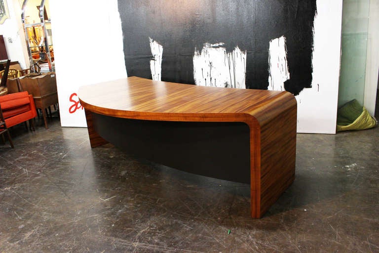 Crescent desk designed by Vladimir Kagan and made in the workshops of VK Designs New York. Beautifully figured Avodire veneer over solid oak substrate.The desk has six drawers that include a file drawer. dimensions: 82