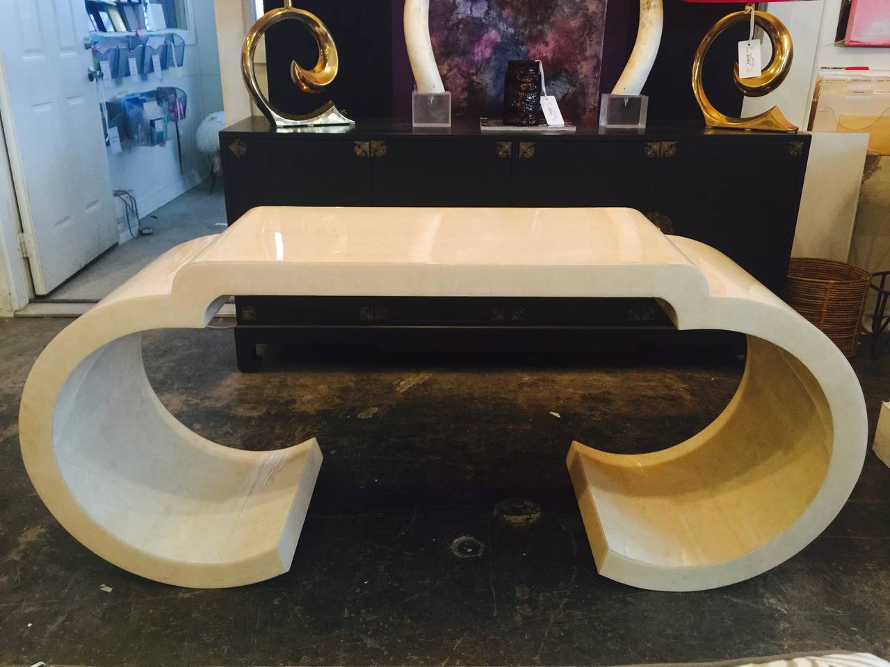Parchment style console with faux skin finish. The console has lacquer finish.
circa. 1970s 

dimensions: 65