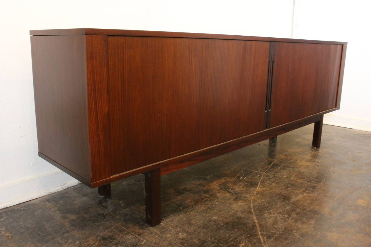 Rosewood tambour credenza by Hans Olsen. There are three (3) adjustable shelves and two (2) pull-out drawers on the inside of the credenza. Design number stamped on underside, circa 1960s

dimensions: 83