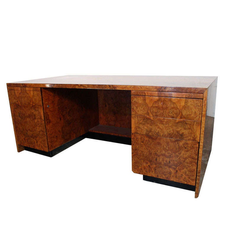 Handsome burl wood executive desk. There are six drawers with two pull-out ledges for extra surface on both sides.