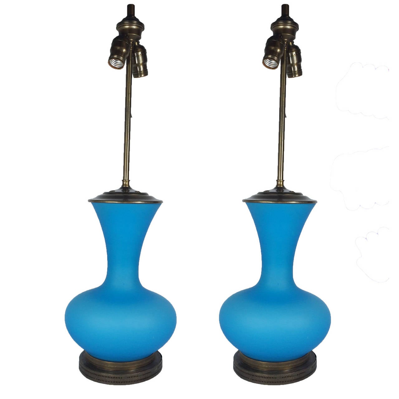 Pair of blue opalescent lamps with brass base and top. Lamps offer two bulb receptacles. Has original wiring, circa 1950s.

**Shades not included.