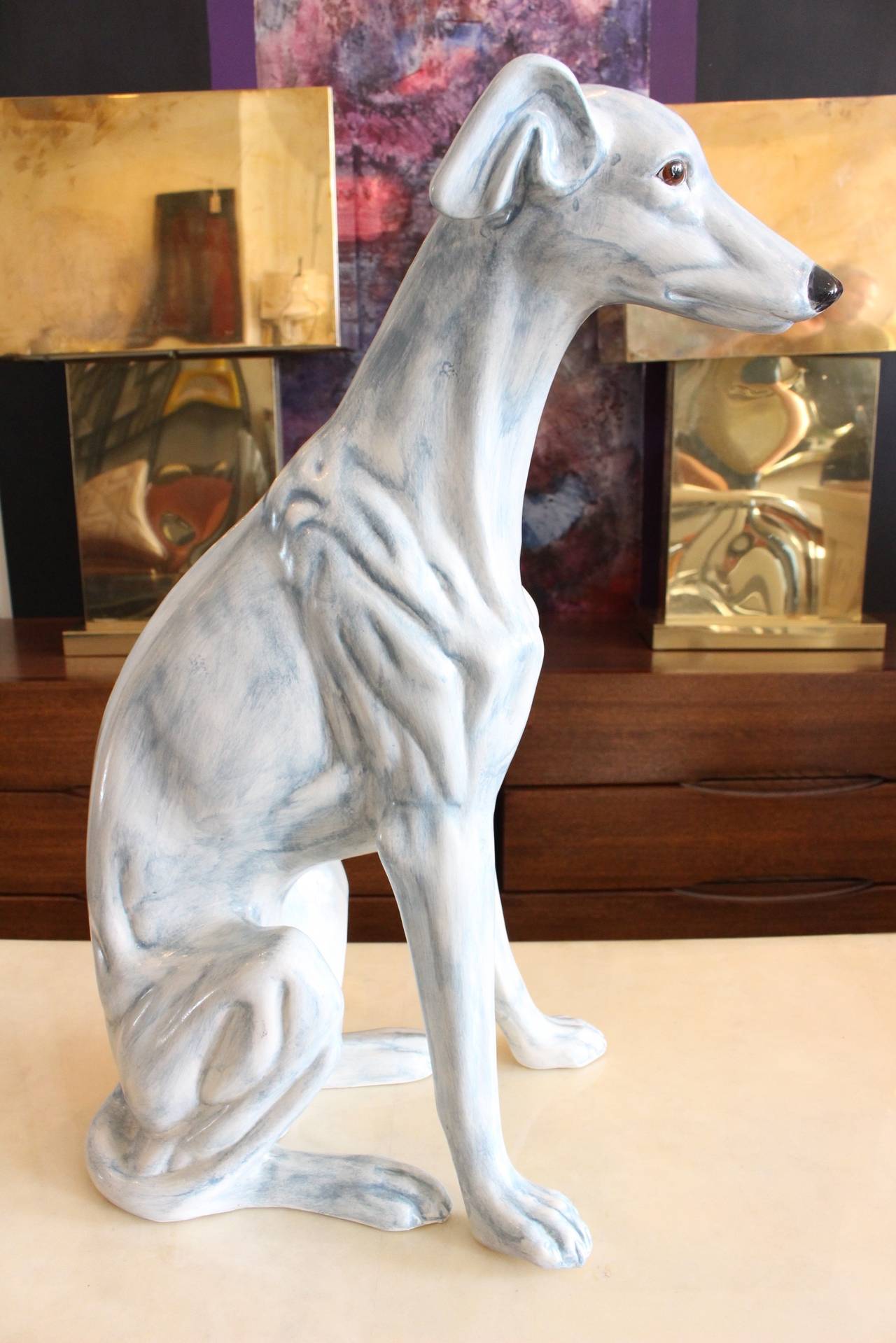 Porcelain whippet or greyhound with a light blue glaze, circa 1970s.

Dimensions: 14