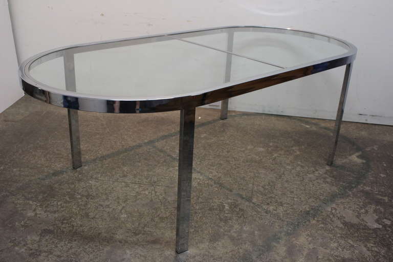 Chrome and glass racetrack dining table by Milo Baughman. dimensions are 95.25