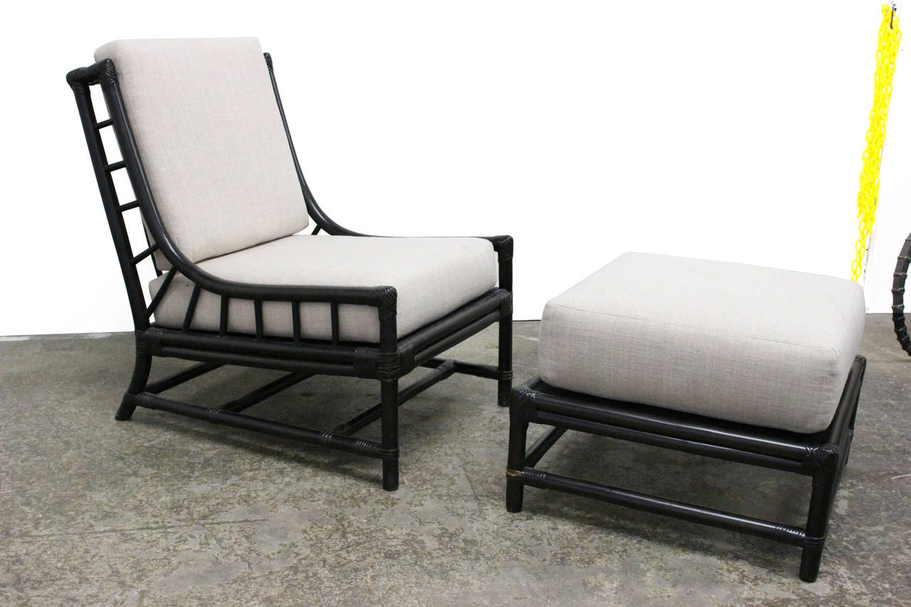 Ebonized rattan lounge chair and ottoman for The Pavilion Collection designed by Tommi Parzinger for Willow & Reed.  Cushions have recently been recovered. 

Dimensions: 24" x 30" x 32, seat height 17" chair.
Dimensions: