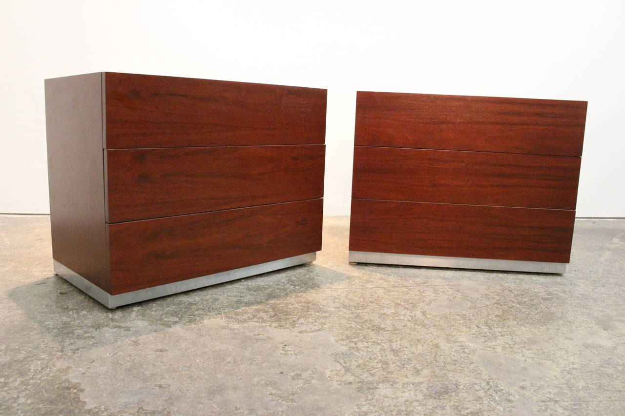 Pair of rosewood nightstands by Milo Baughman. There is ample storage with three drawers per nightstand. Chrome plinth base, circa 1960s.

Dimensions: 31" x 18" x 24.5".