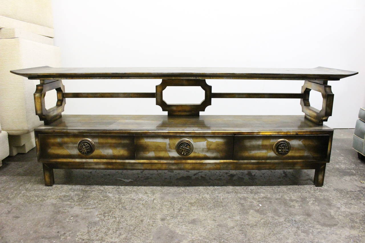 Signed James Mont Console gilded in silver and gold. 

Dimensions: 75.5" W x 19" D x 28" T.