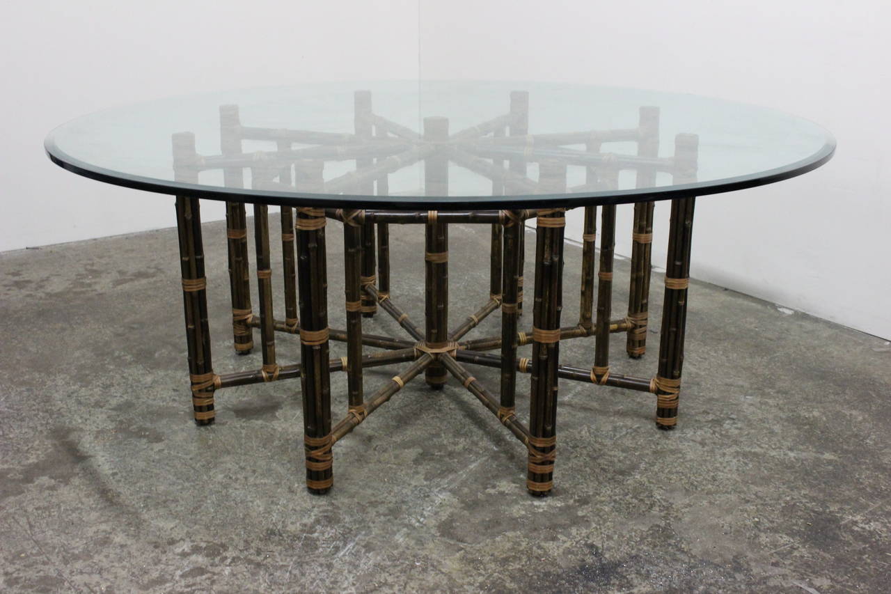 Monumental bamboo dining table by McGuire. Bamboo rods strapped together with leather to table frame. 74