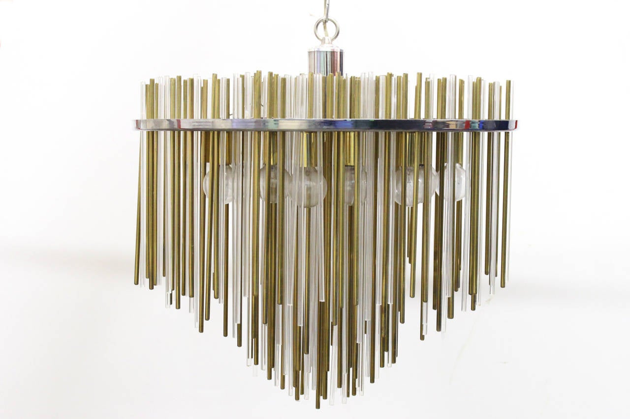 Gorgeous Lucite and brass rod chandelier by Sciolari. Sixteen-light receptacles, circa 1970s.

Dimensions: 21