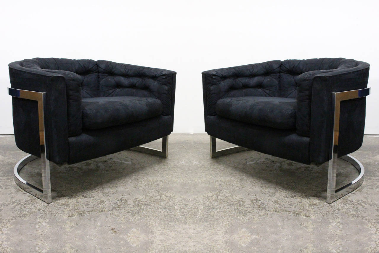 Pair of monumental scale cantilevered tub chairs in the style of Milo Baughman with chrome bases. From the 1970s, need upholstery. Covered in black micro suede, chrome frames are in excellent condition are heavy weight gauge steel.

Dimensions: