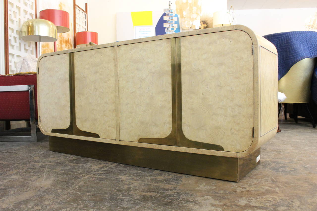 Newly refinished, this bleached burl wood credenza by Mastercraft features brass inlay on top and on the side of credenza, circa 1970s.

Dimensions: 64.5