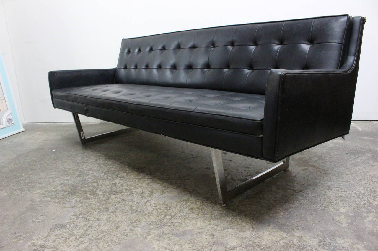 Rare black vinyl sofa by Milo Baughman for James Inc. Tufted seat and back with chrome legs. original black vinyl, circa 1960s.

Dimensions: 77