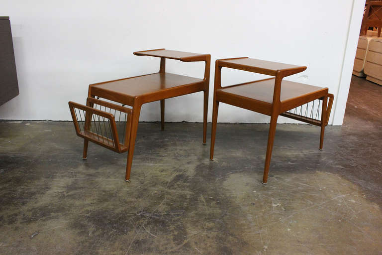Very handsome pair of side tables, with detachable magazine racks, by Kurt Ostervig. Made of teak with clean modern lines.