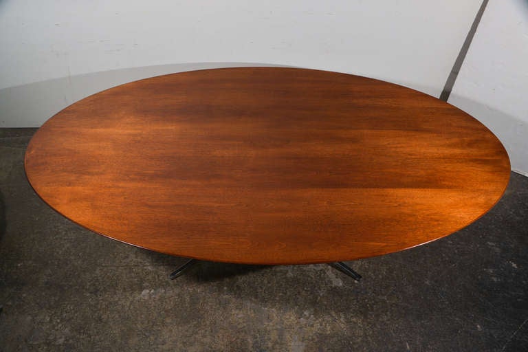 Walnut oval dining table with chrome base by Florence Knoll. Rare eight foot length.