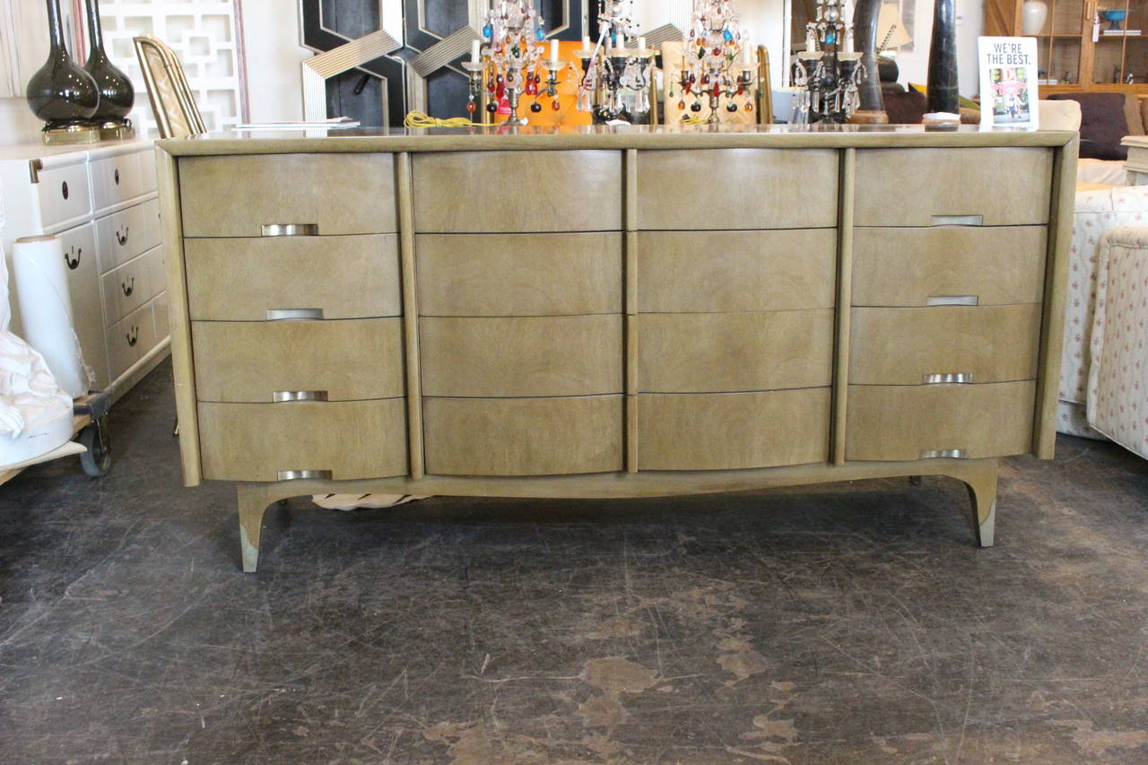 Twelve (12) drawer dresser in bleached mahogany by American of Martinsville.

dimensions: 66